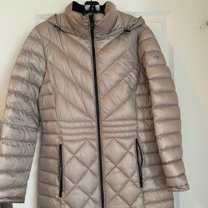Cappuccino-colored Calvin Klein puffer jacket good for 7 degrees Fahrenheit